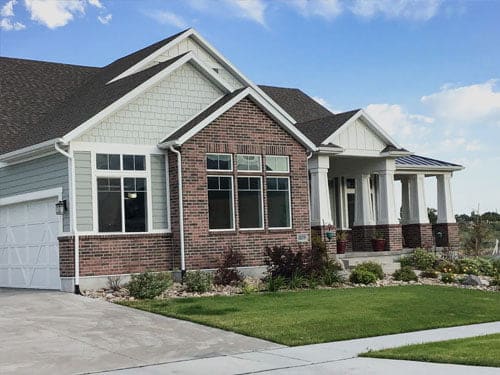 huge house with glass windows and brick sidings