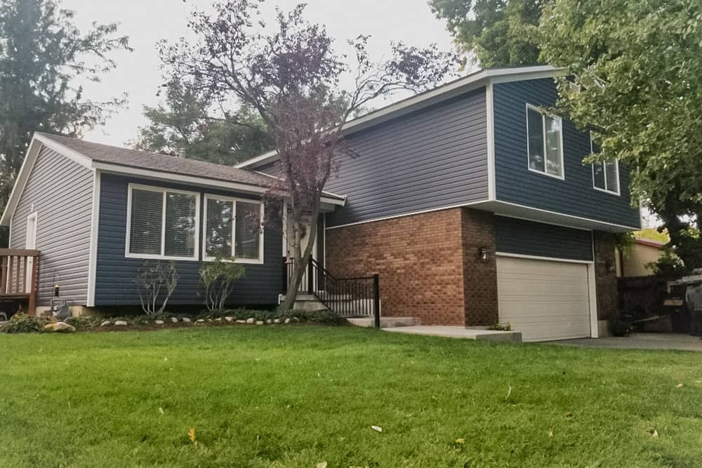 house with blue wood siding